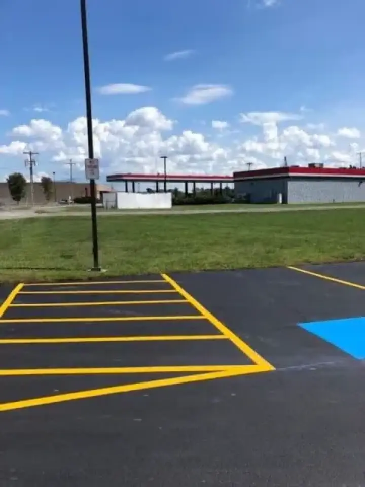 freshly painted ada compliant lines for handicapped parking space