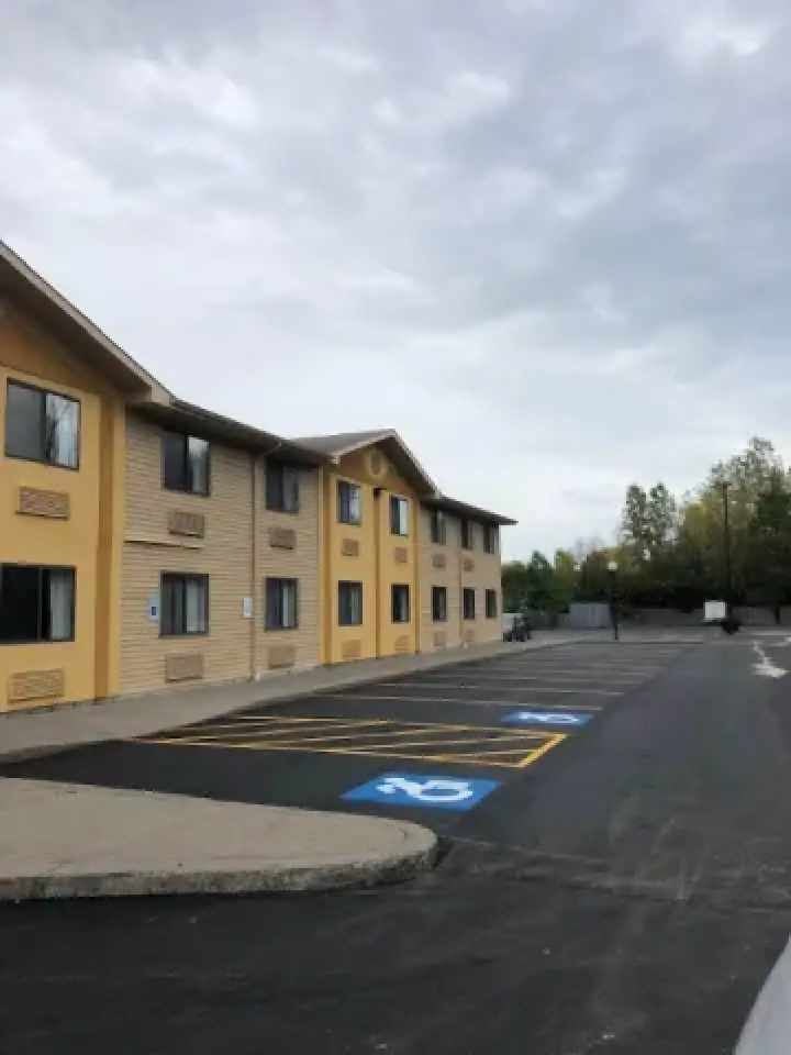 exterior of a hotel showing two handicapped parking spots