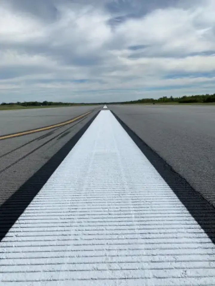freshly repainted line at an airport landing area