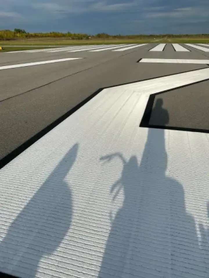 very large symbols freshly restriped at an airport