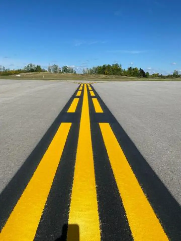 white and yellow airport striping