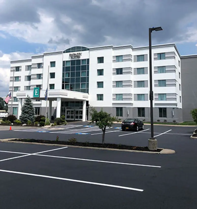 freshly painted parking spots in white hotel parking lot