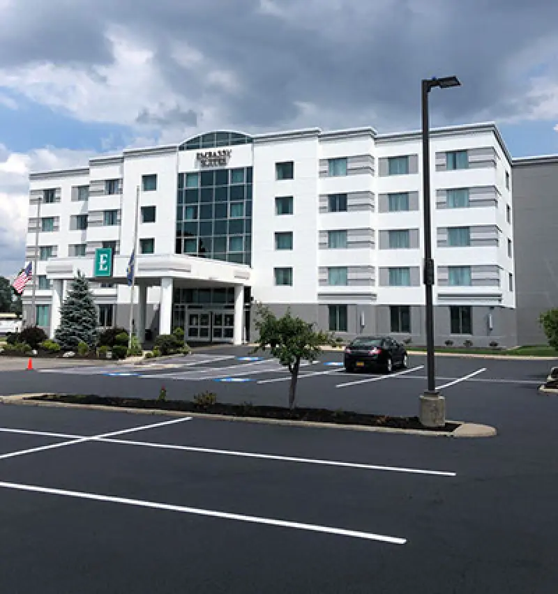 fresh parking lot paint in front of hotel