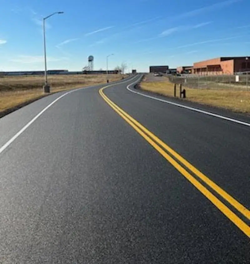 fresh double yellow line and white line on road