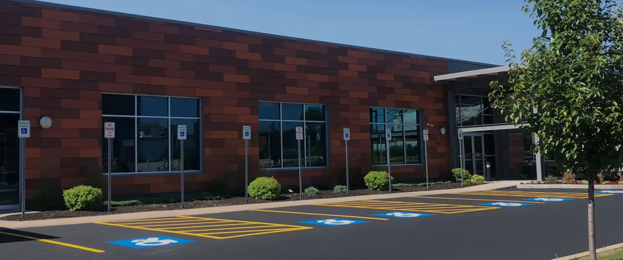 brick building with fresh parking lot paint