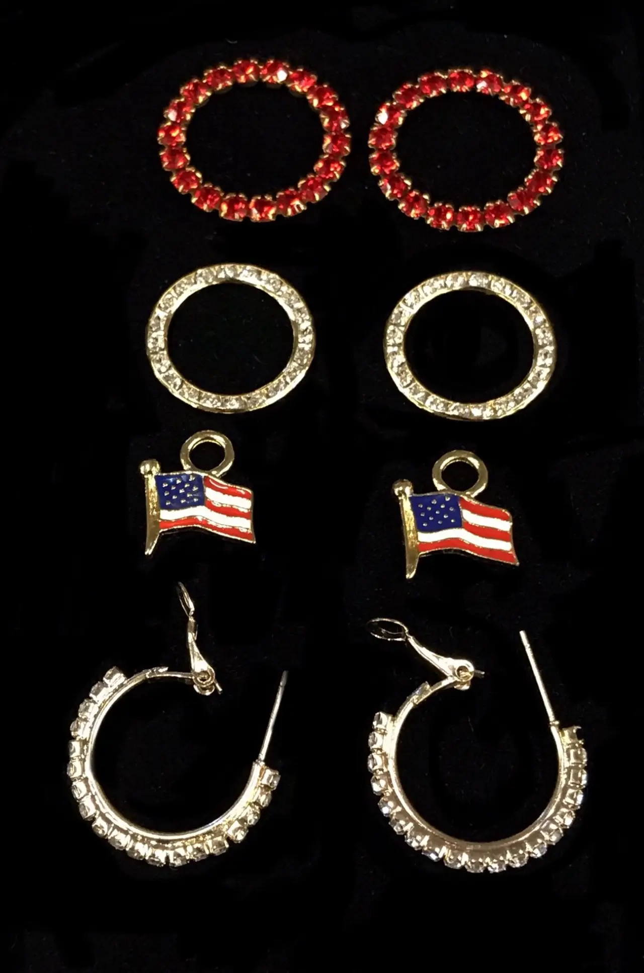Flag set with crystal hoops and large crystal rings $72