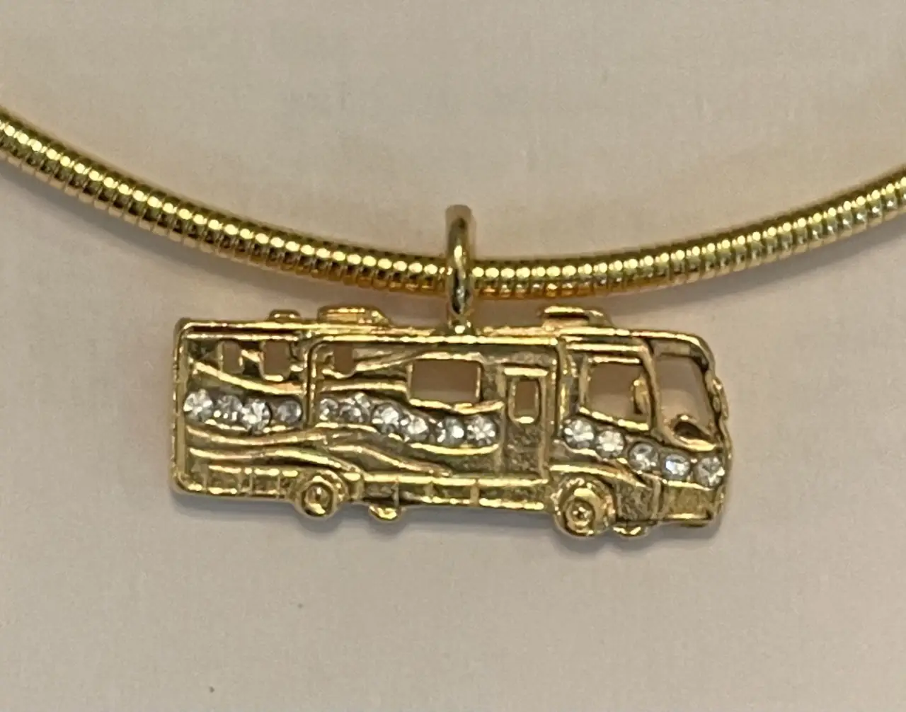 Motor Coach pendant with crystal  $39.95. (Pendant only)