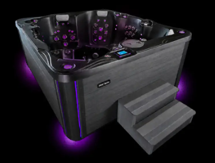 Midnight Series hot tub with purple LED lighting and steps