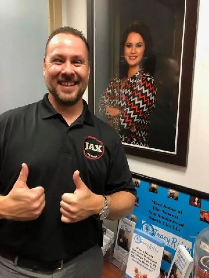 a man with two thumbs up