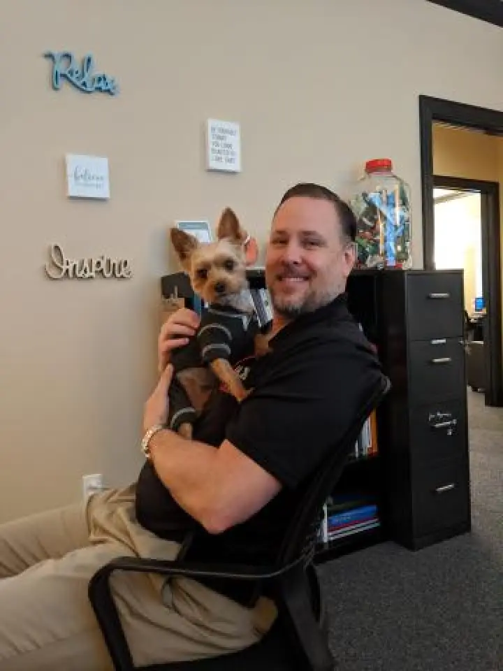 a man with two dogs