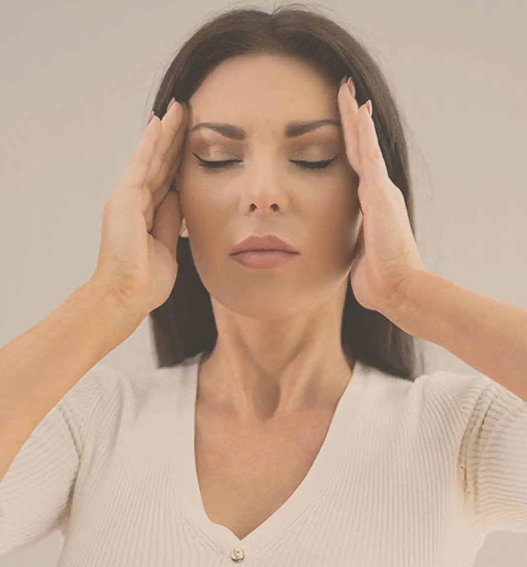 woman holding her head