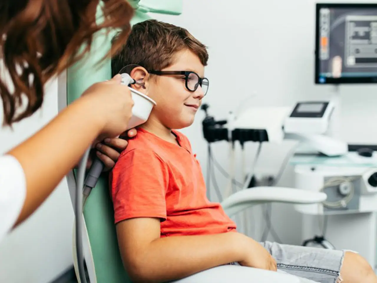 child having ear examined