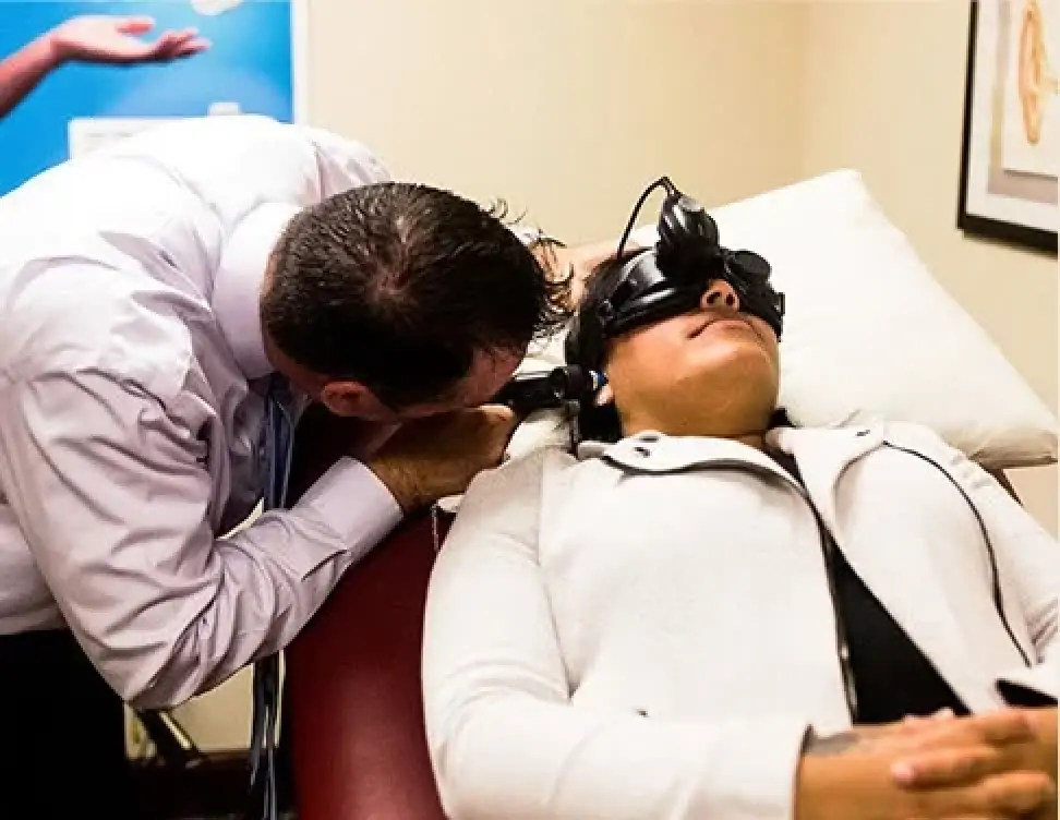 doctor performing test on patient