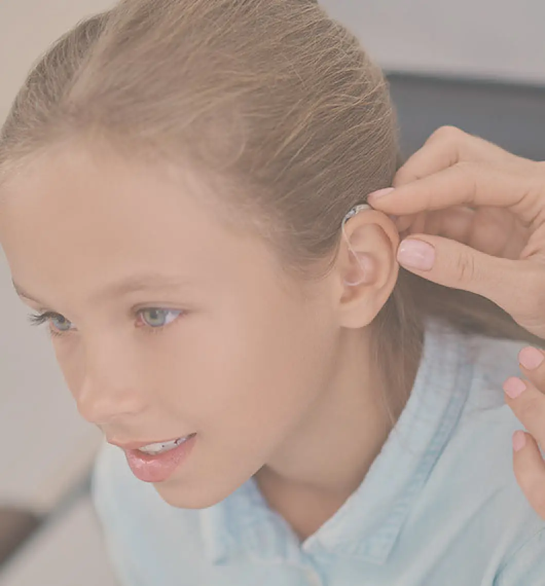 girl with hearing aid