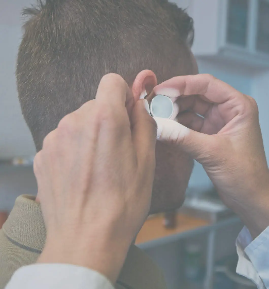 man getting ear emaxmined