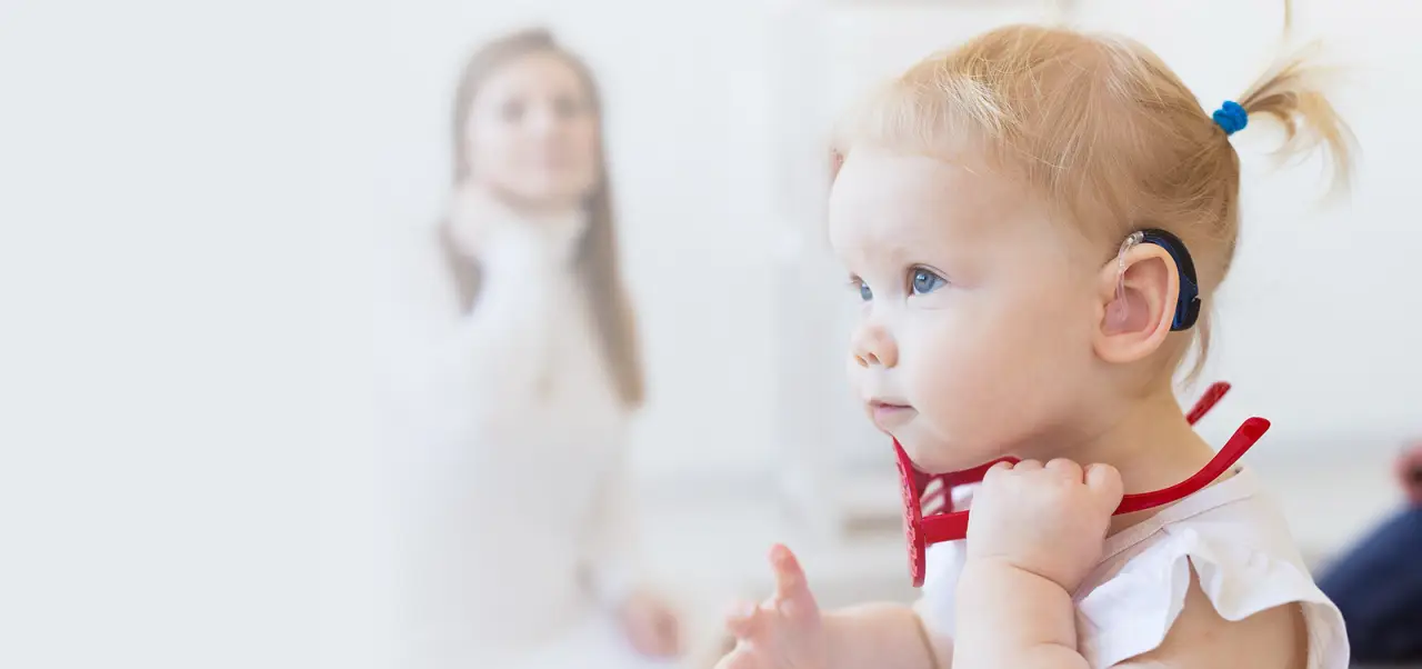baby with hearing aid