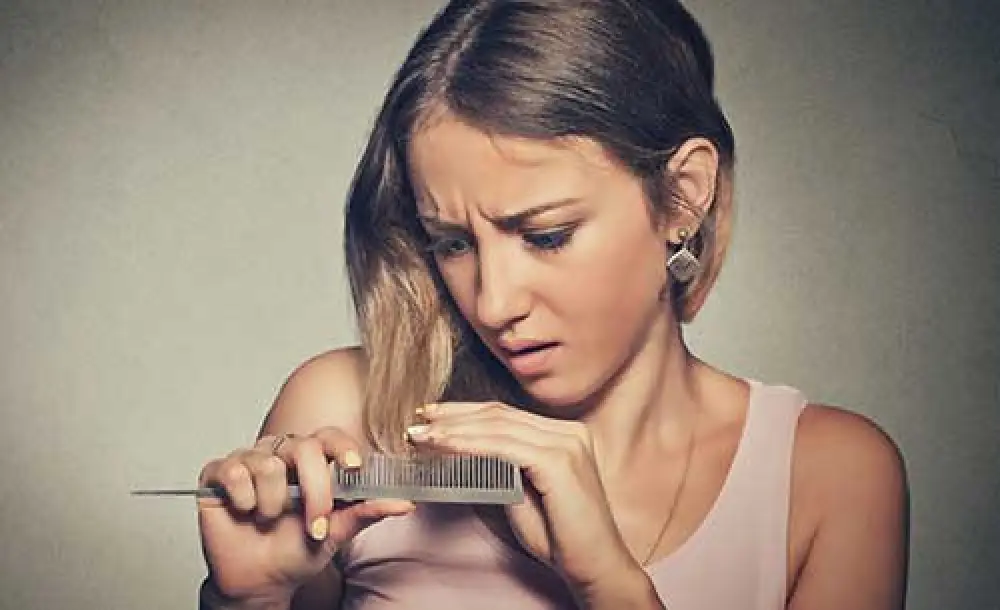 Woman experiencing hair loss