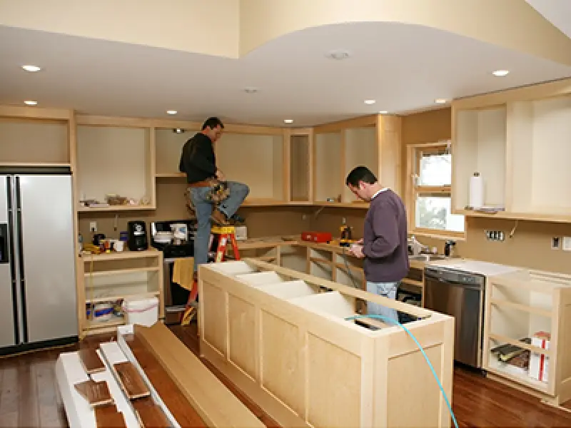 class a construction team remodeling a kitchen
