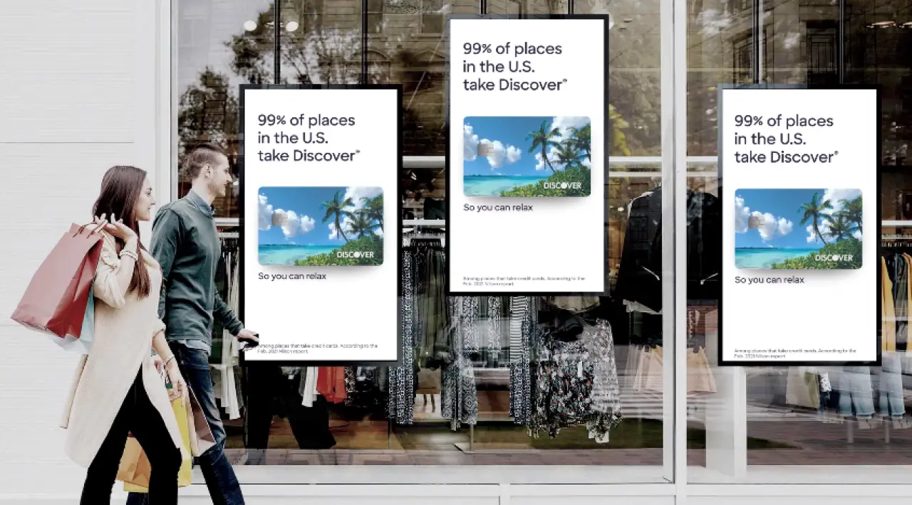 two shoppers walking by simple pos digital signage