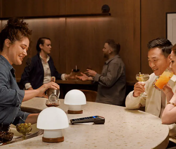 couple sitting at classy cocktail bar