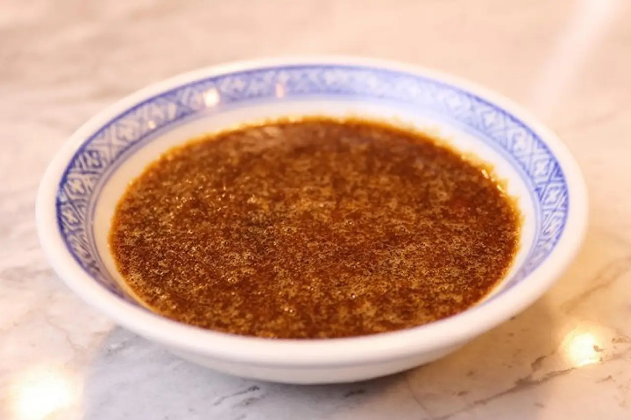 Teppanyaki ginger dipping sauce in a small patterned bowl.
