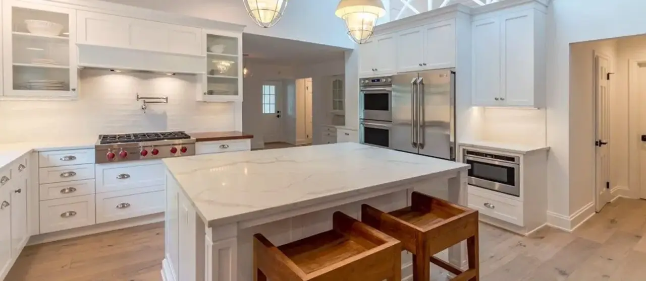 marbled countertops with white cabinets