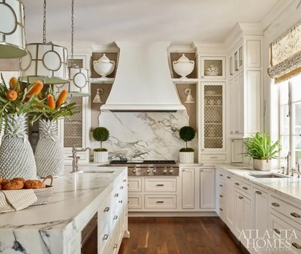 bright kitchen with a marble scalloped backsplash