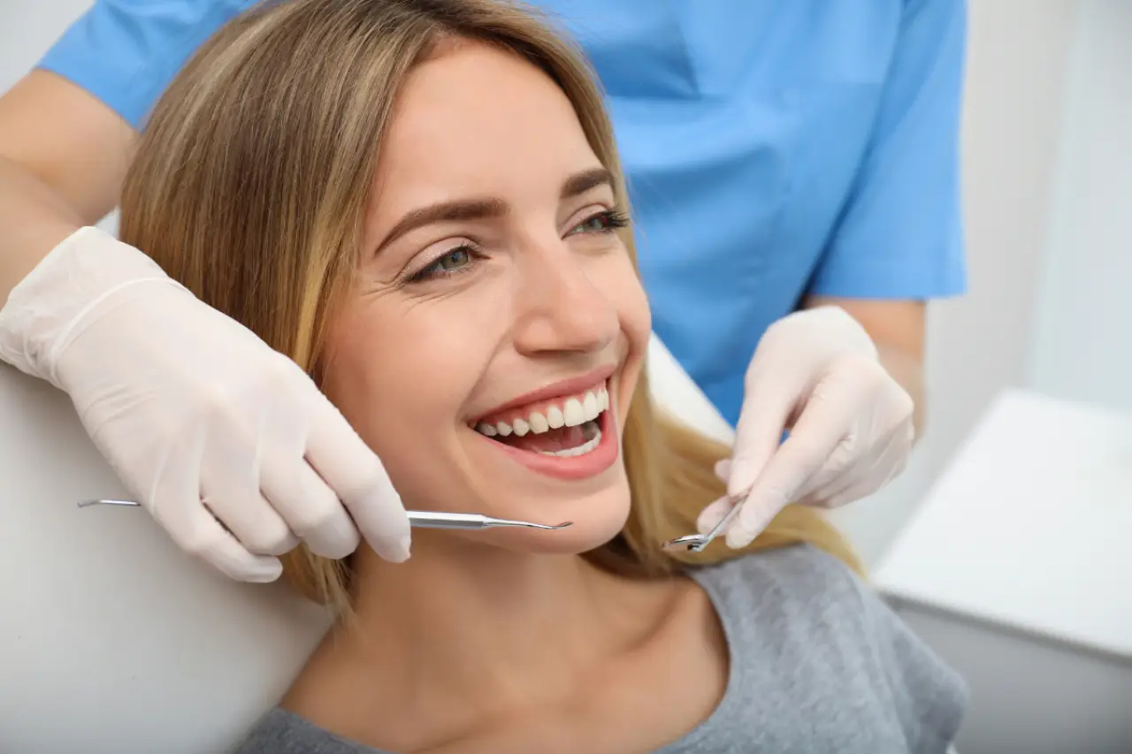 woman smiling over smile makeover lakeville ny