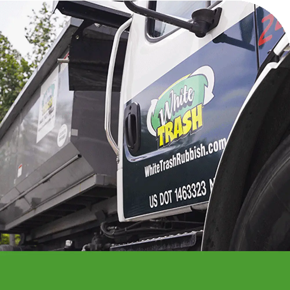 white trash disposal dumpster hauling truck