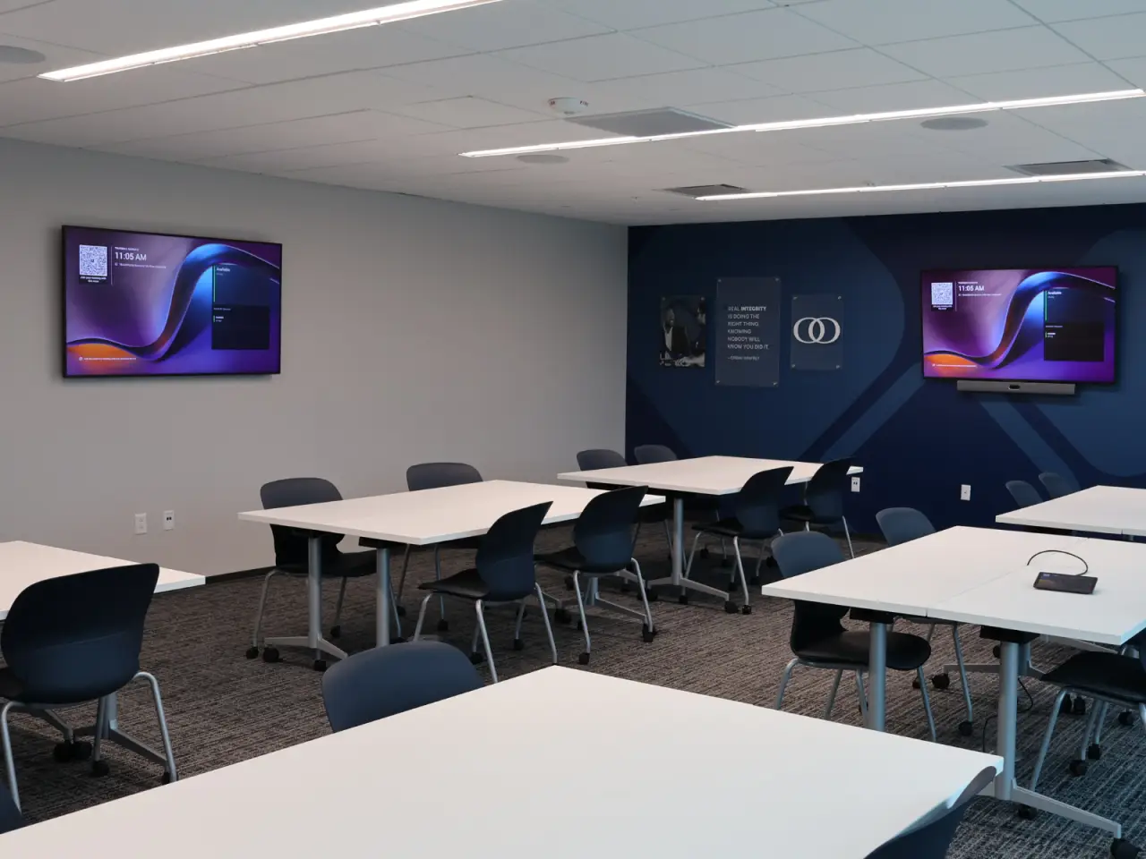 Training space at a bank headquarters equipped with commercial displays by Fusion Digital.