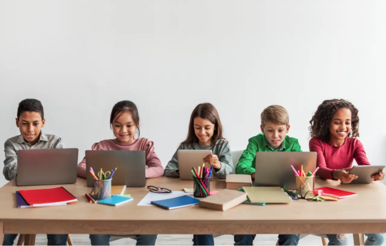 children at school on laptops