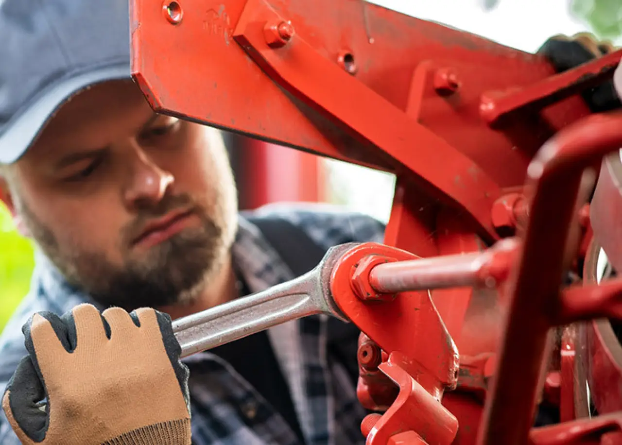 man using a forged wrench