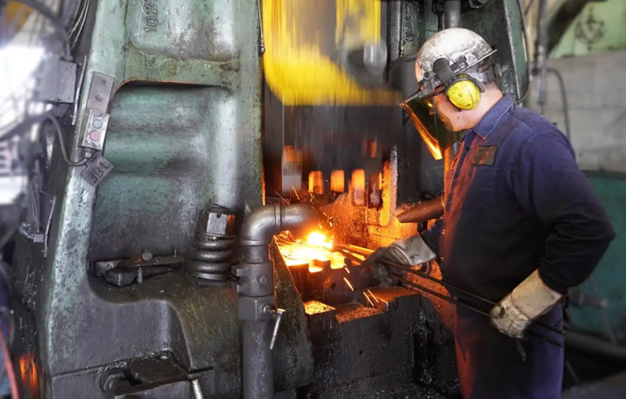 man forging