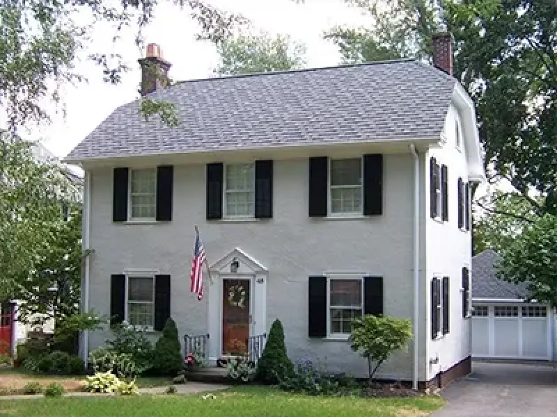 new roof installed on white colonial style house in rochester ny