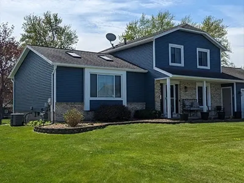 new blue vinyl siding installed on home in rochester ny