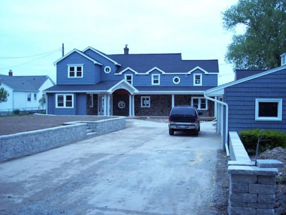 home with large addition and exterior renovations by american custom inc