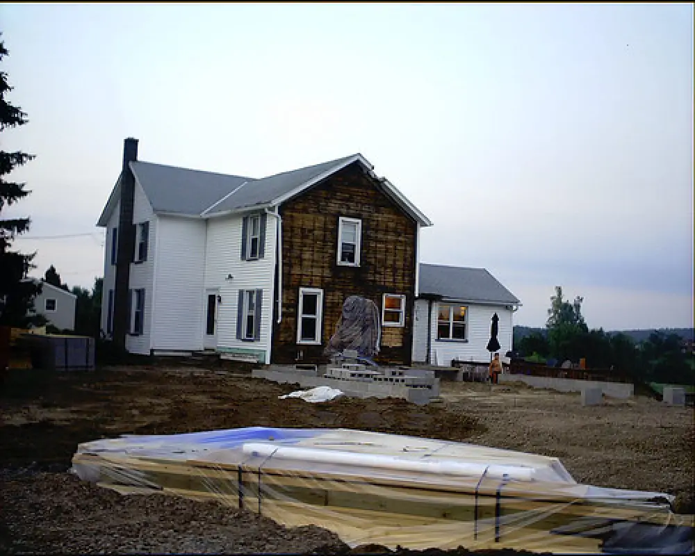white house with level out ground for construction