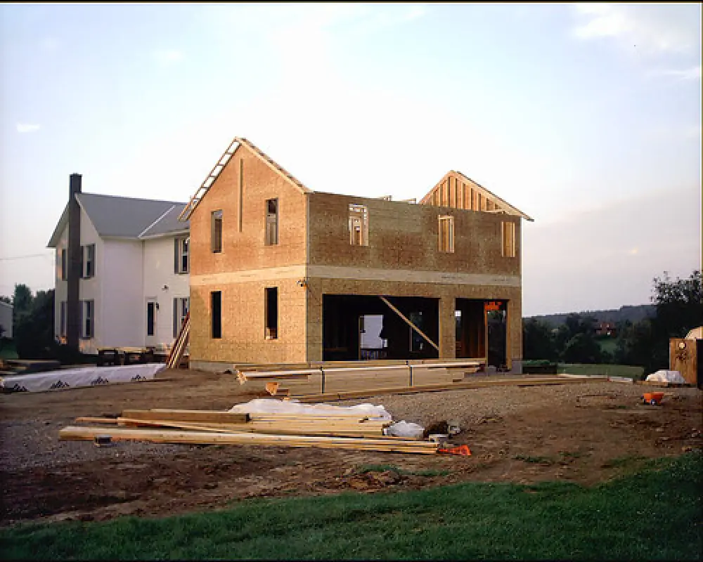 large two story addition being framed in rochester ny