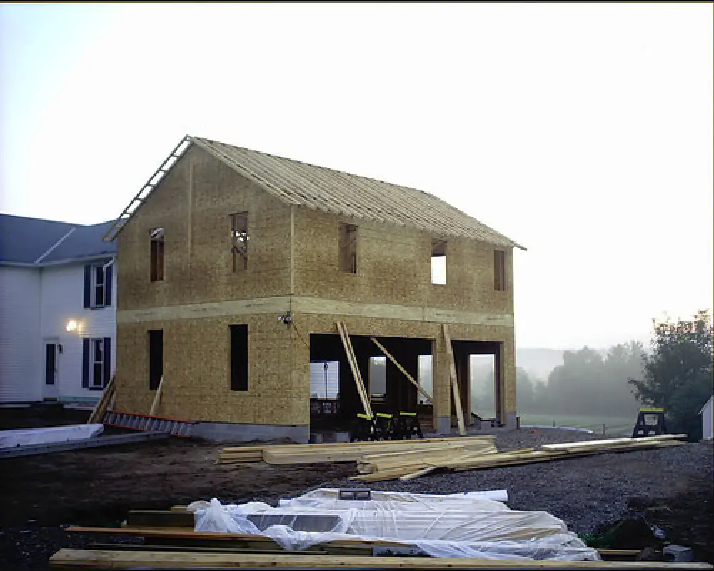 two story addition with new garage being built