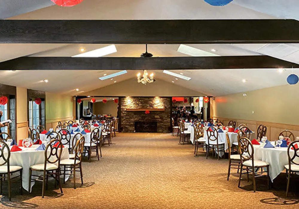 banquet room set up white tablecloths red napkins