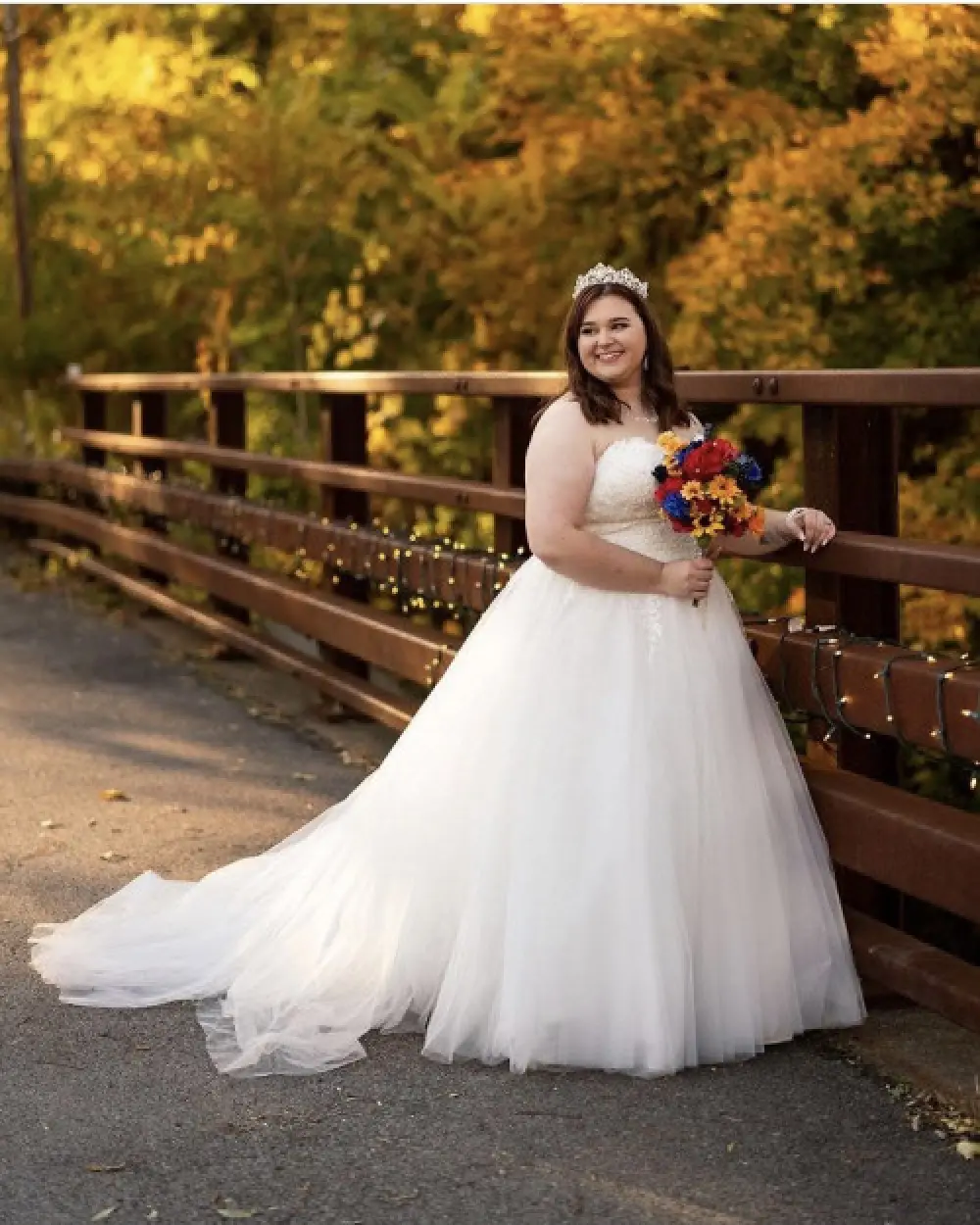 bride standing by fence