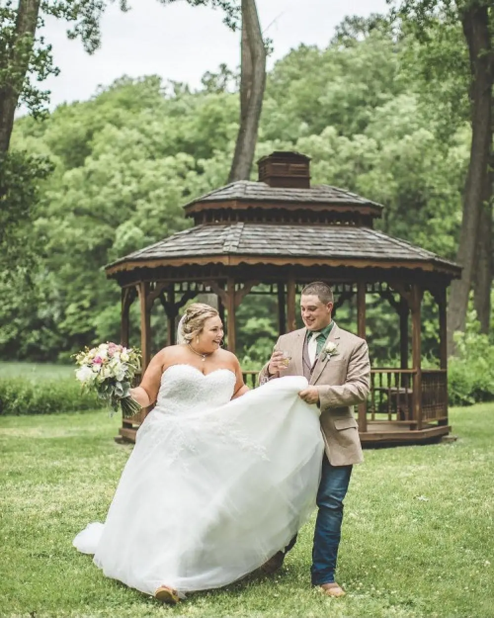 bride groom in front of gazebo