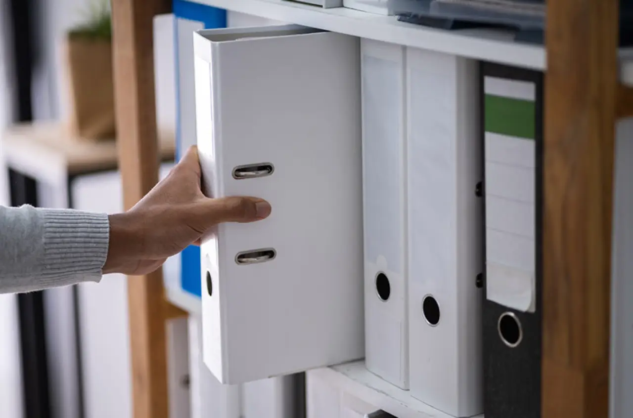 hand reaching for binder