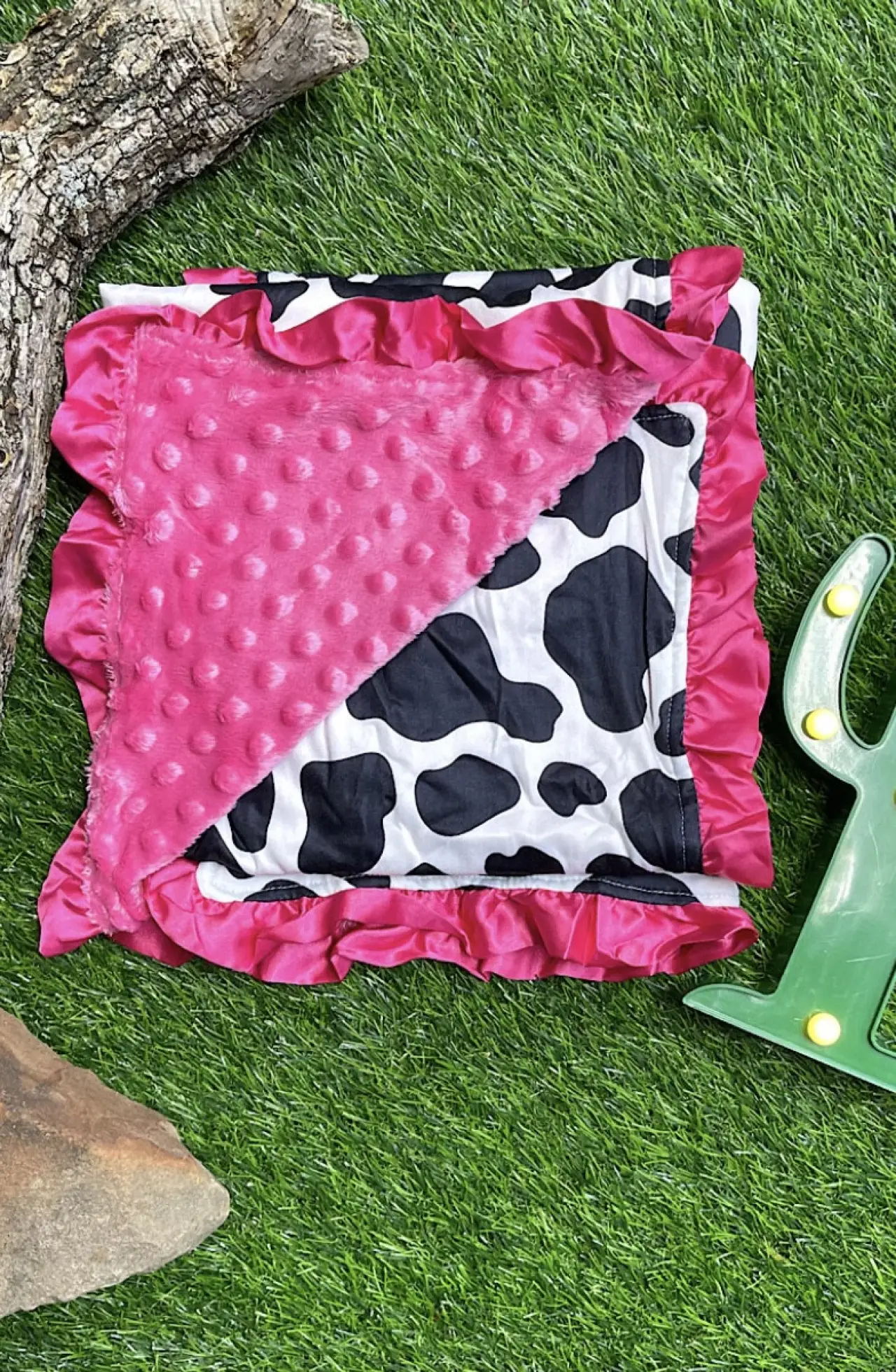 cow spot printed minky blanket with fuchsia ruffle