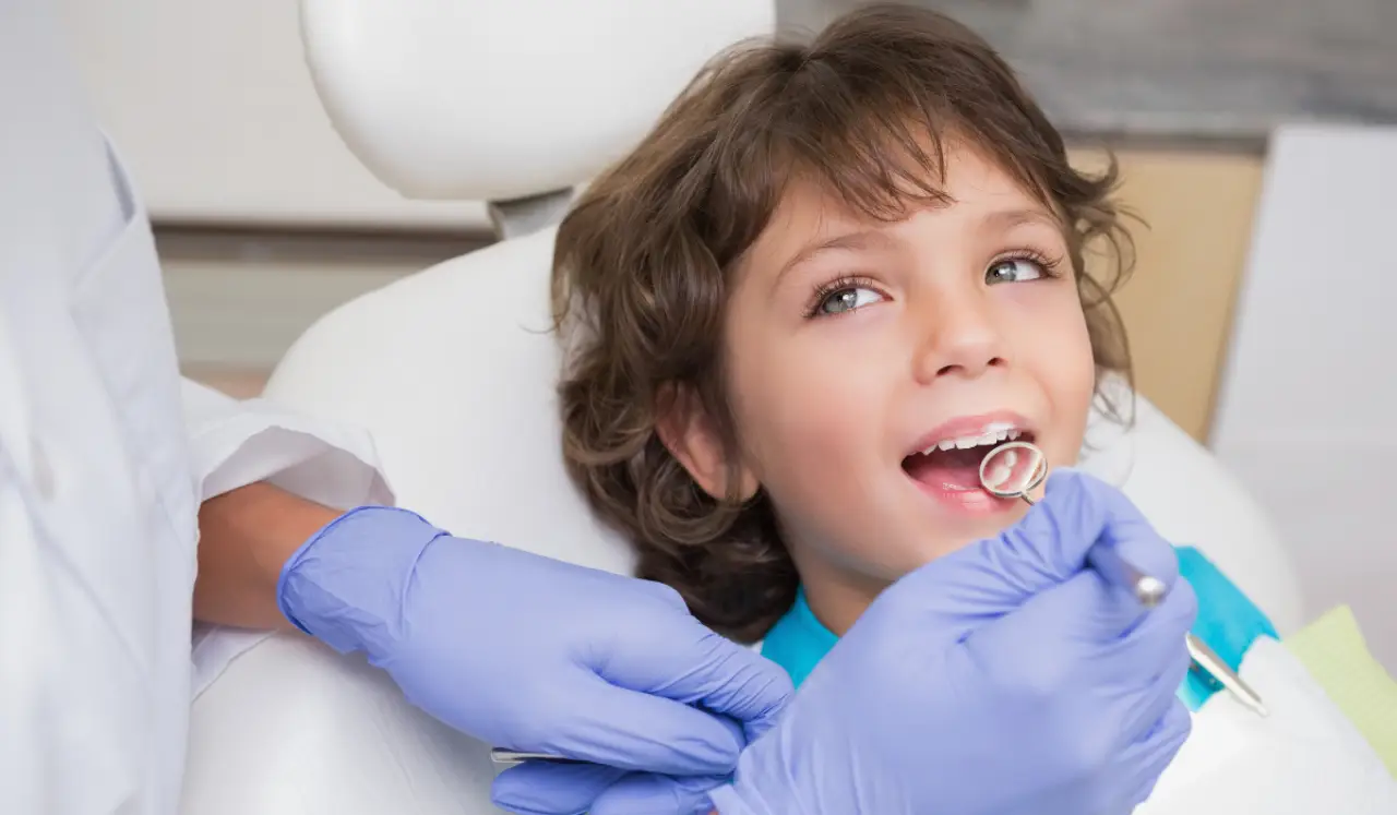 Child caring for their teeth and gums as part of a healthy dental routine.