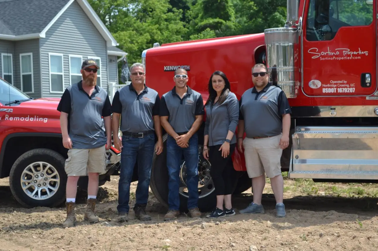 the sortino properties team with their trucks