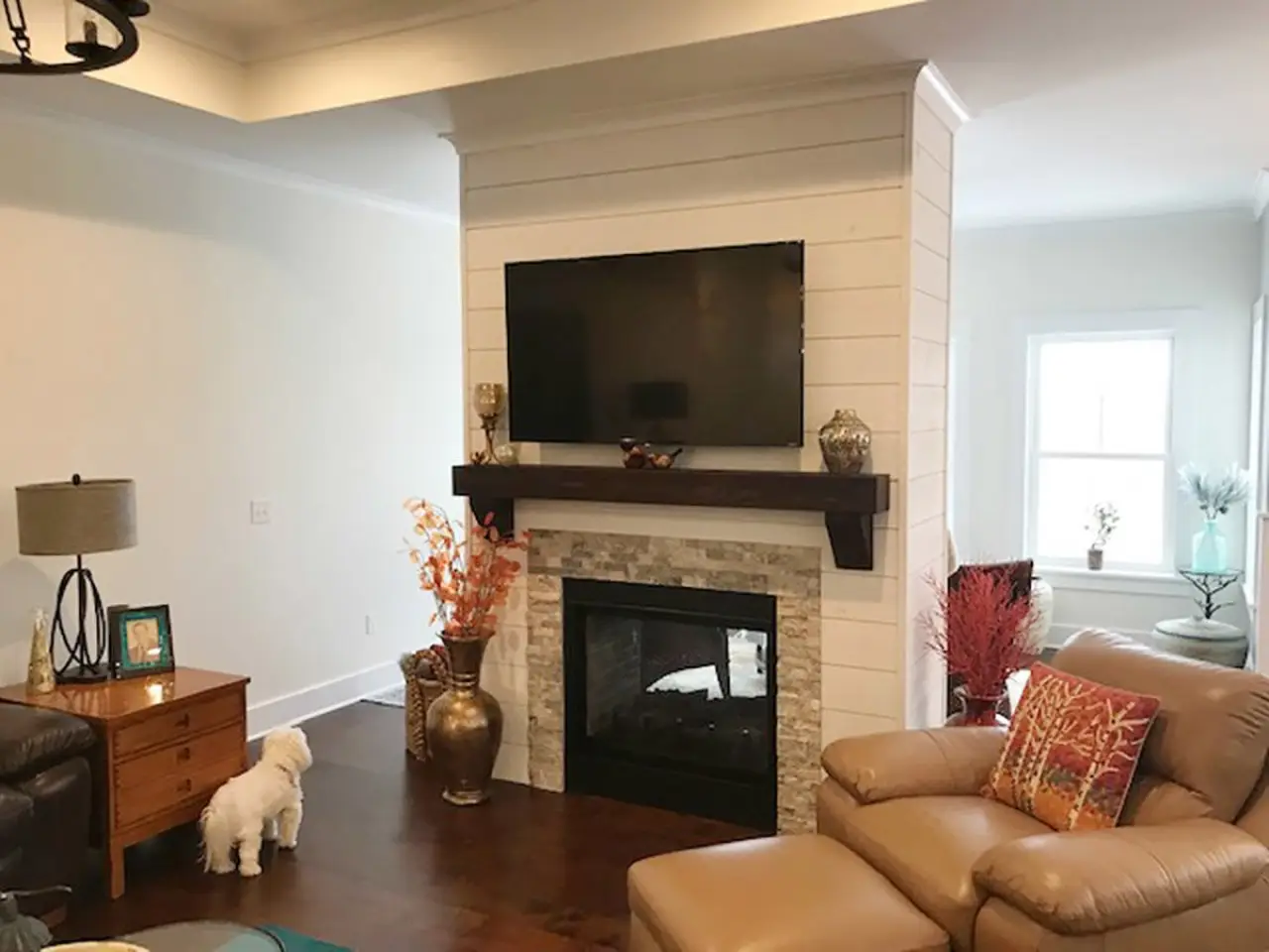 Two-sided fireplace of custom built home by Sortino Properties in Livonia NY.