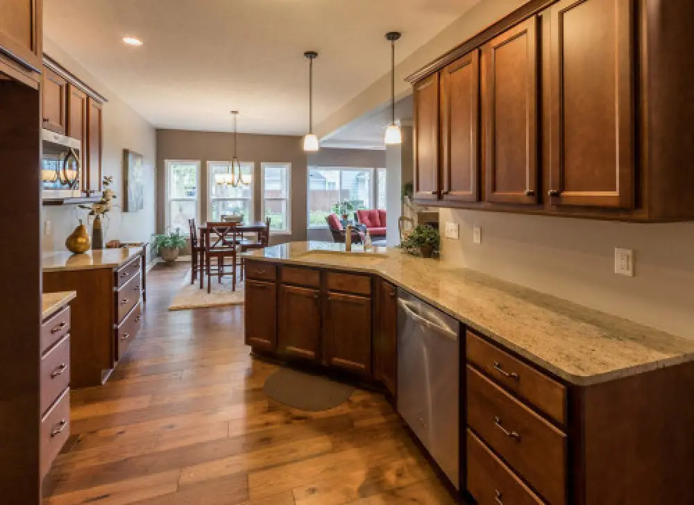 Kitchen and dining area in a Villas at Churchville ranch home by Sortino Properties.
