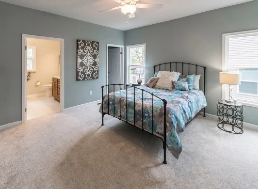 Master bedroom in a Villas at Churchville ranch home by Sortino Properties.