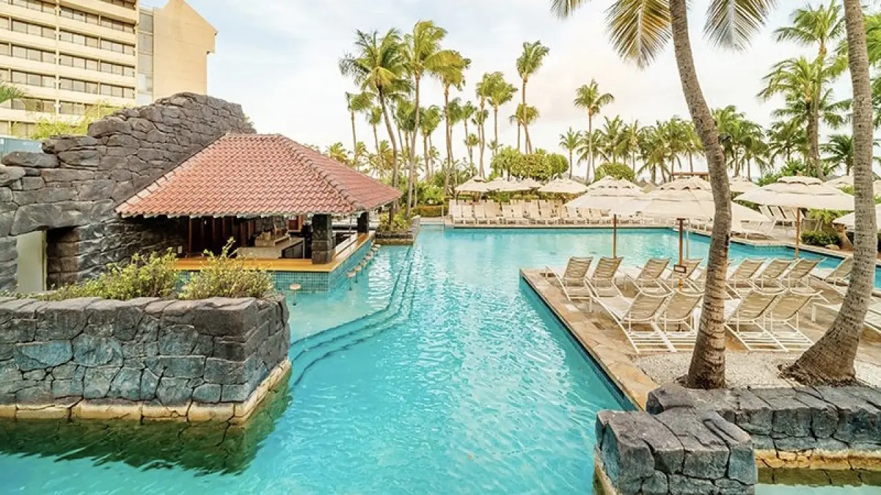 a pool with a building in the background